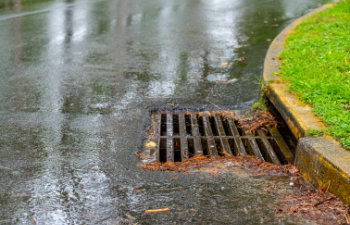 metal storm drain during a rain