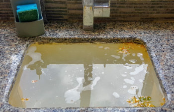 overflowing kitchen sink